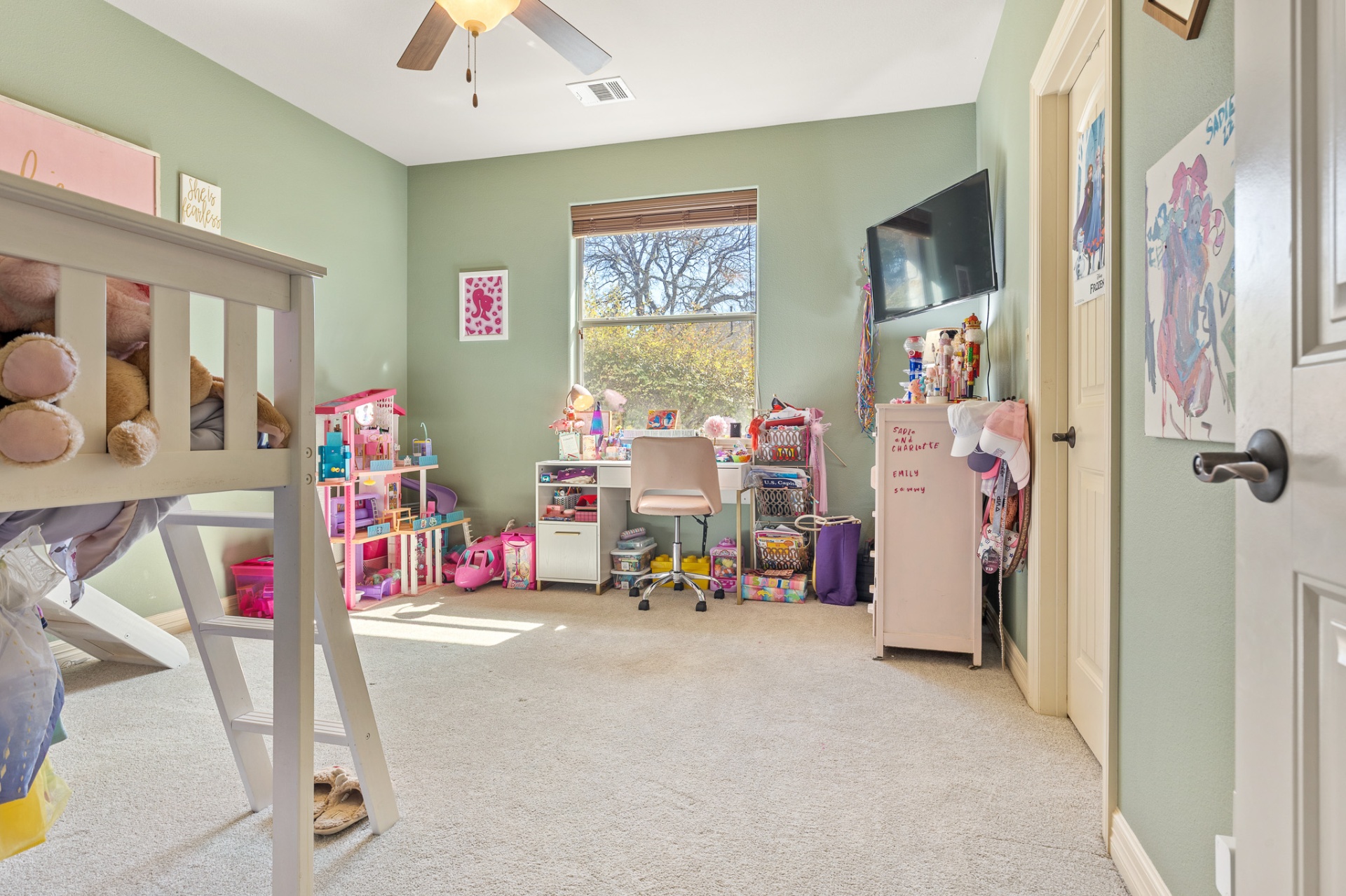 Third bedroom with ceiling fan and natural light