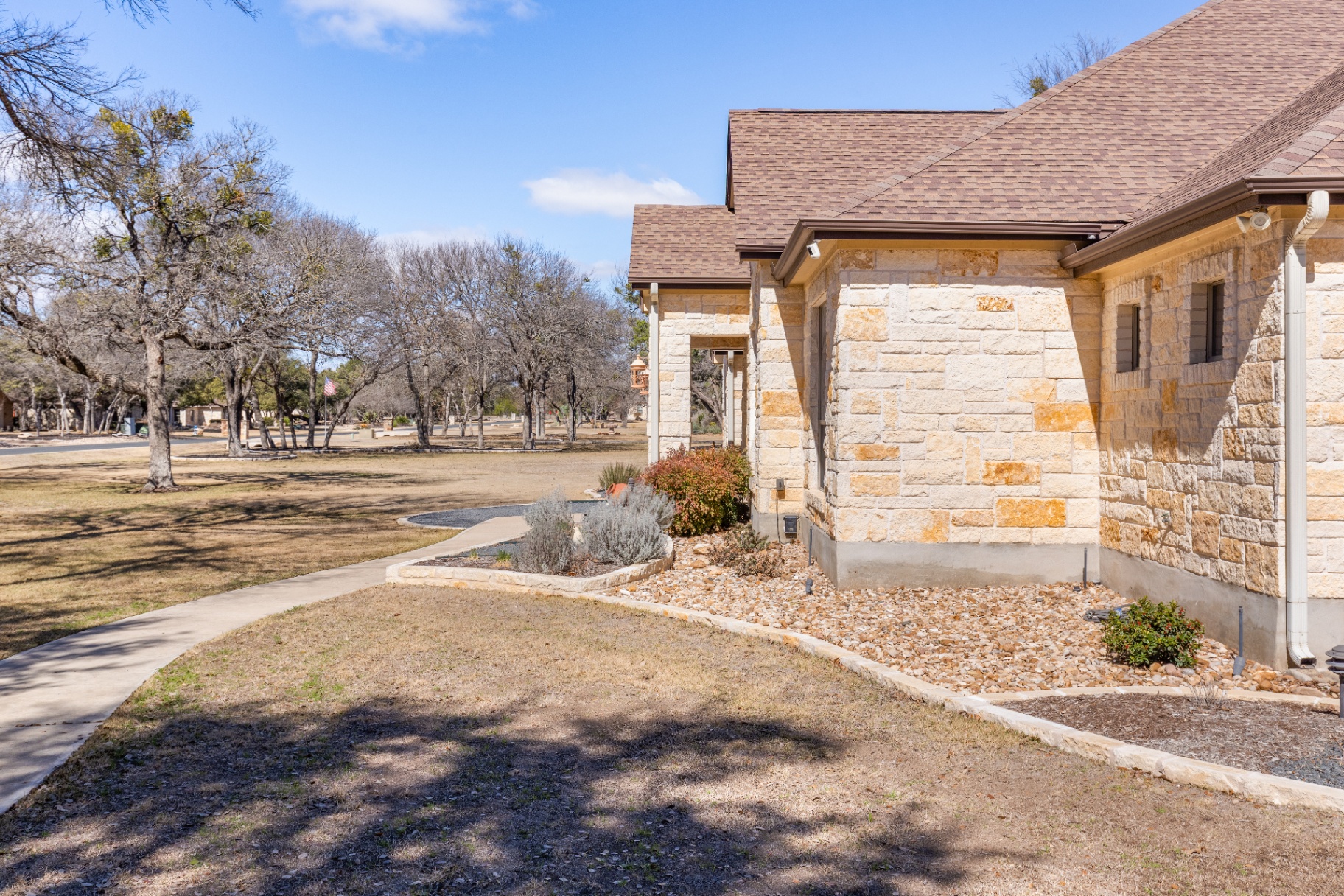 Entry walkway and landscaping with Shady Oaks Estates views